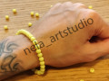 Náramek kulička žlutý